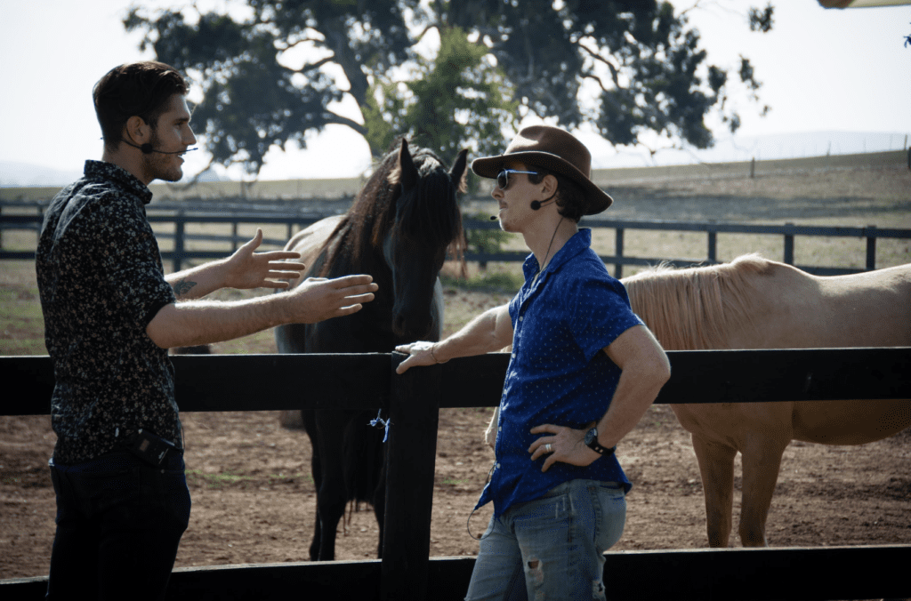 equine therapists chatting by horses